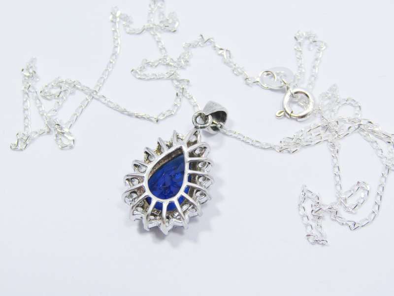 A Beautiful Royal Blue Teardrop Design Zirconia Pendant on Chain in Sterling Silver. R695   A