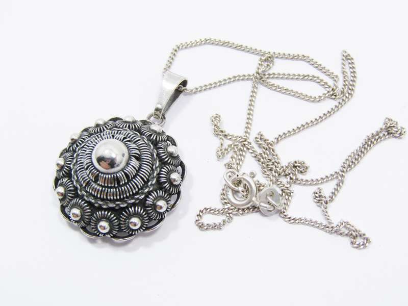 A Lovely Vintage Dutch Button Pendant on Chain in Silver.