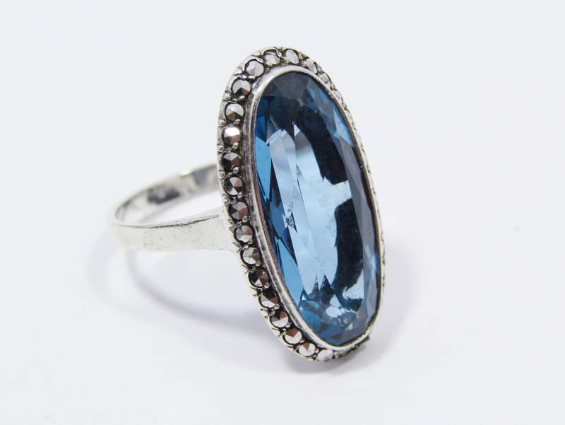 A Gorgeous Vivid Blue Synthetic Spinal Ring Surrounded with Marcasite's in Sterling Silver