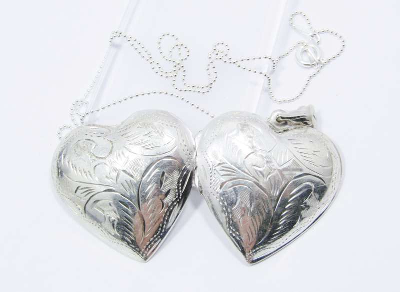 A Stunning Large Engraved Heart Locket On Chain in Sterling Silver.