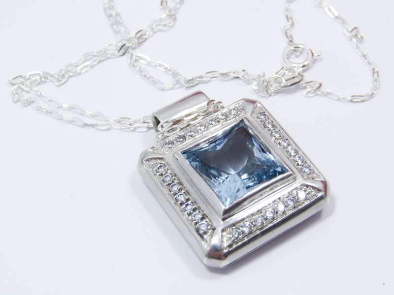 A Gorgeous Square Blue And Clear Zirconia Pendant on Chain in Sterling Silver.