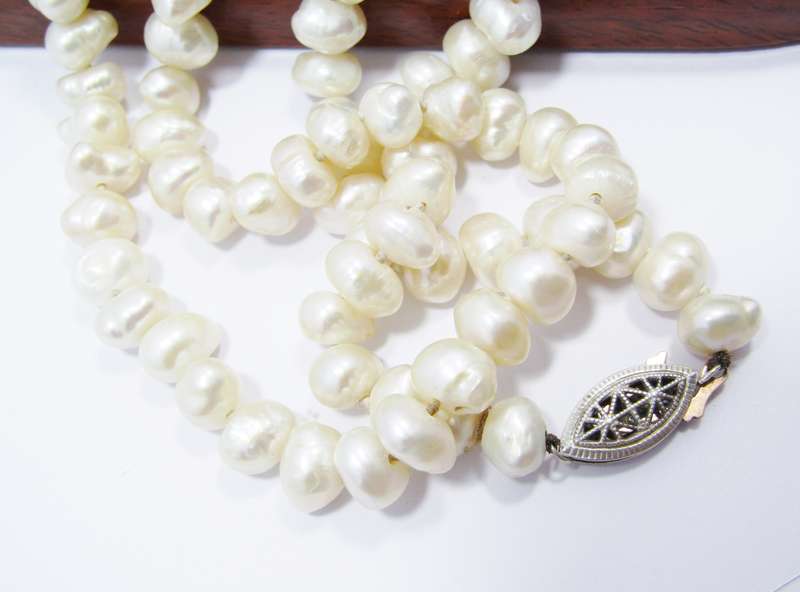 Lovely Long String of Freshwater Pearls with Silver Clasp