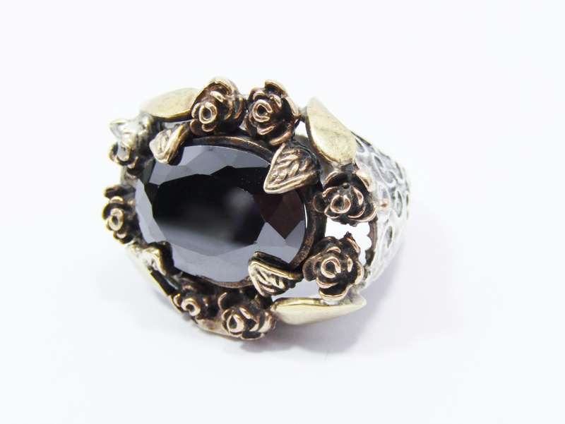 A Beautiful Chunky Black Stone Ring With a Copper Detail over Sterling Silver
