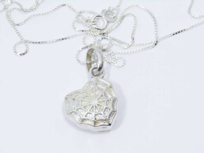 A Beautiful Spider Web Heart Locket Pendant on Chain in Sterling Silver.
