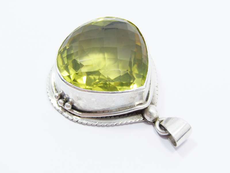 A Gorgeous Huge Faceted Lemon Quartz Pendant in Sterling Silver.