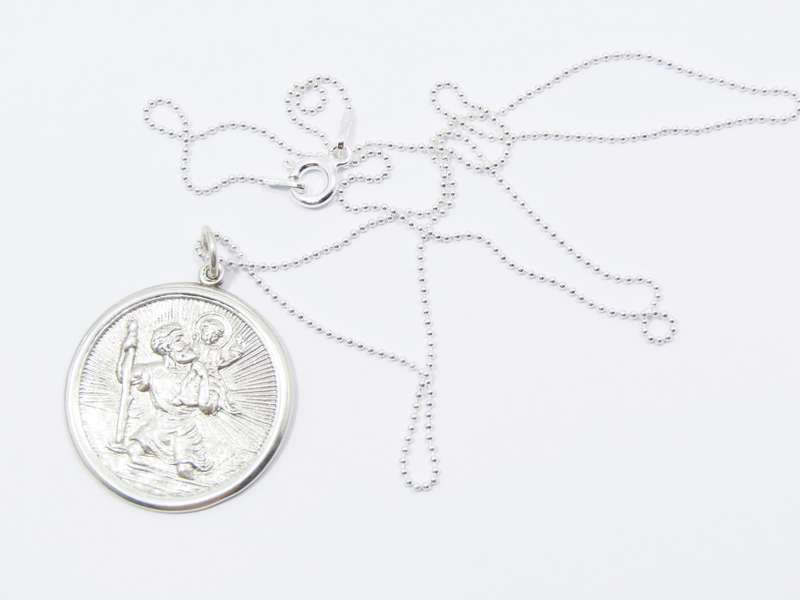 A Beautiful Detailed Round St Christopher Pendant on Chain in Sterling Silver.