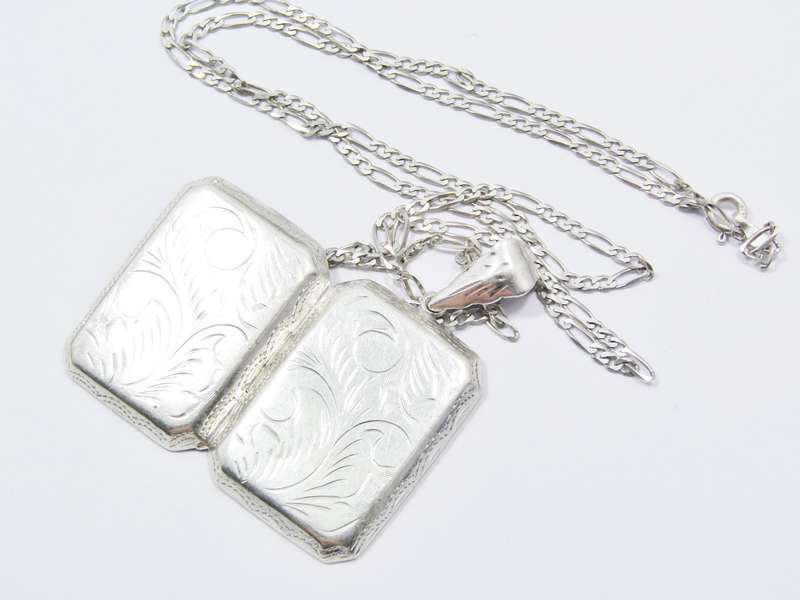 A Gorgeous Large Rectangular Engraved Locket On Chain in Sterling Silver.