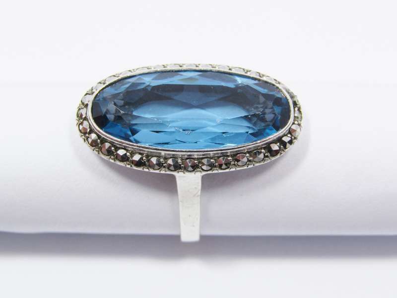 A Gorgeous Vivid Blue Synthetic Spinal Ring Surrounded with Marcasite's in Sterling Silver