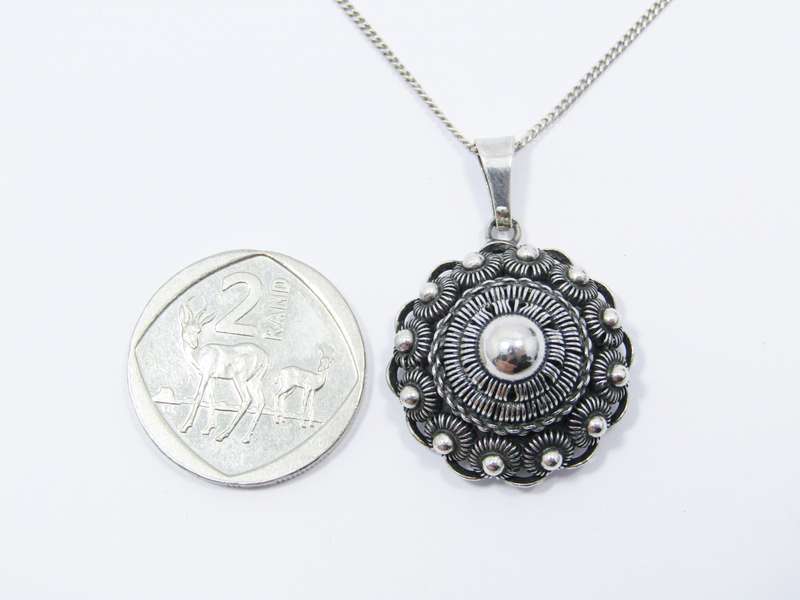 A Lovely Vintage Dutch Button Pendant on Chain in Silver.