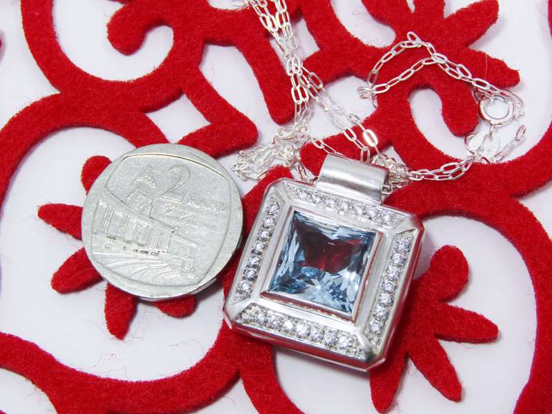 A Gorgeous Square Blue And Clear Zirconia Pendant on Chain in Sterling Silver.