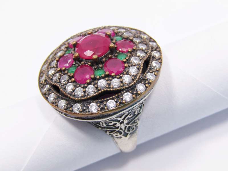 A Gorgeous Huge Eastern Design Ring Set With Pink, Green and White Crystals in Sterling Silver.