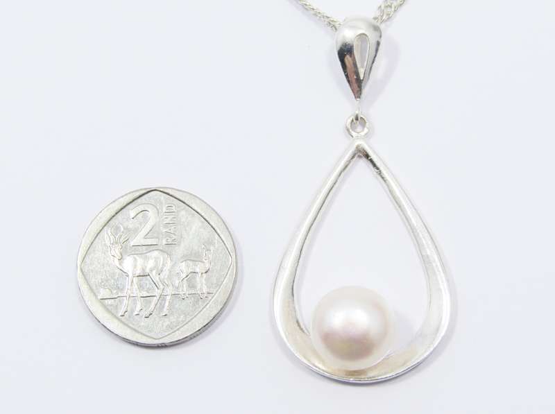 A Beautiful Large Teardrop Design Freshwater Pearl Pendant on Chain in Sterling Silver.
