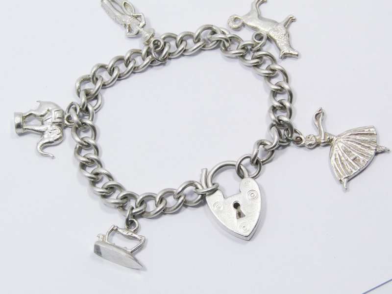 A Stunning Vintage Charm Bracelet With a Padlock Clasp in Sterling Silver