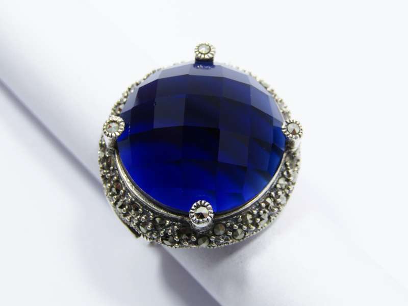 A Beautiful Large Faceted Blue Stone Ring With Marcasite's in Sterling Silver.