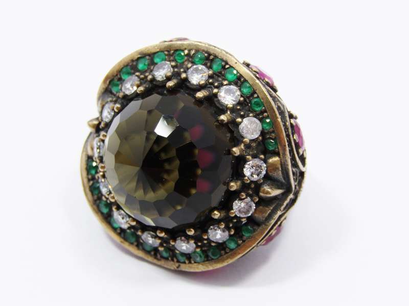 A Gorgeous Huge Facetted Smokey Color Crystal Surrounded With Pink Green and Clear Crystals in Sterl
