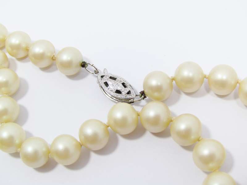 A Lovely String of  Vintage Faux Pearls with a Sterling Silver Clasp