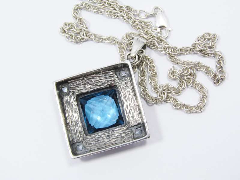 A Stunning Huge Vivid Blue Zirconia Pendant on Chain in Sterling Silver.