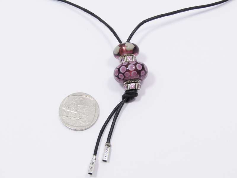 An Early Pandora Sterling Silver & Leather Fob