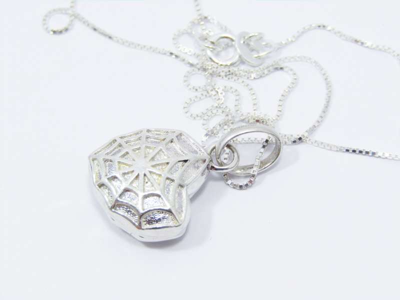 A Beautiful Spider Web Heart Locket Pendant on Chain in Sterling Silver.