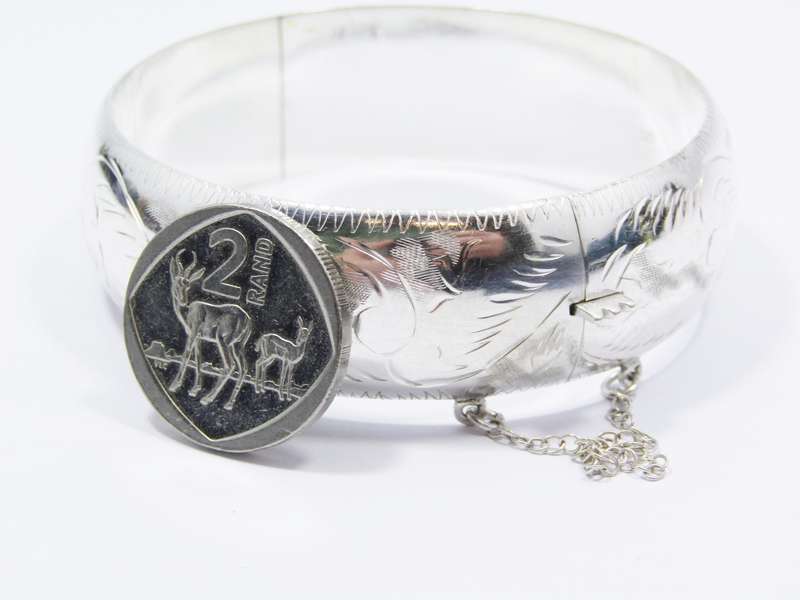 A Gorgeous Broad Engraved Vintage Design Hinged Bangle in Sterling Silver.