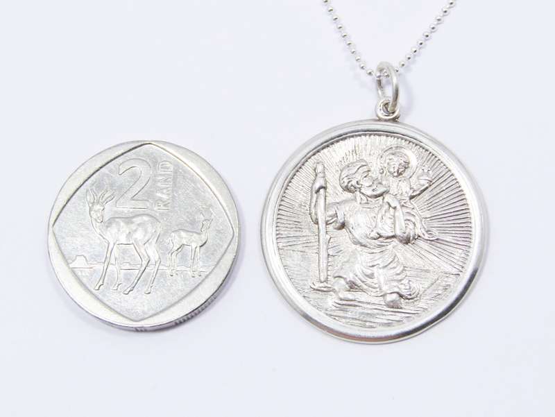 A Beautiful Detailed Round St Christopher Pendant on Chain in Sterling Silver.