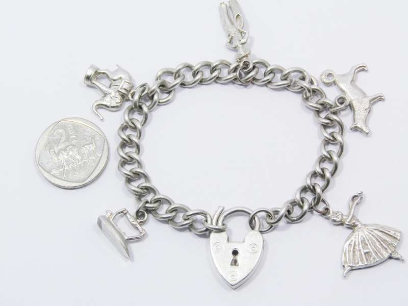 A Stunning Vintage Charm Bracelet With a Padlock Clasp in Sterling Silver