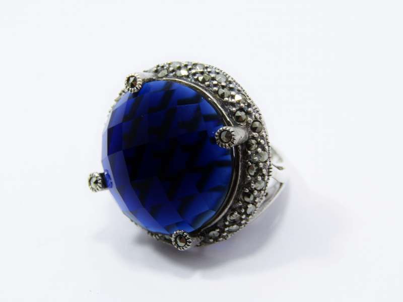 A Beautiful Large Faceted Blue Stone Ring With Marcasite's in Sterling Silver.