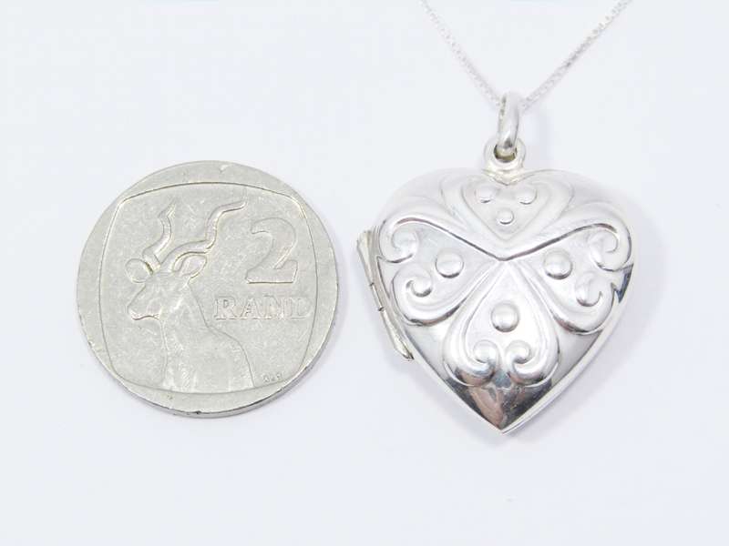 A Lovely Detailed Heart Locket on Chain in Sterling Silver.