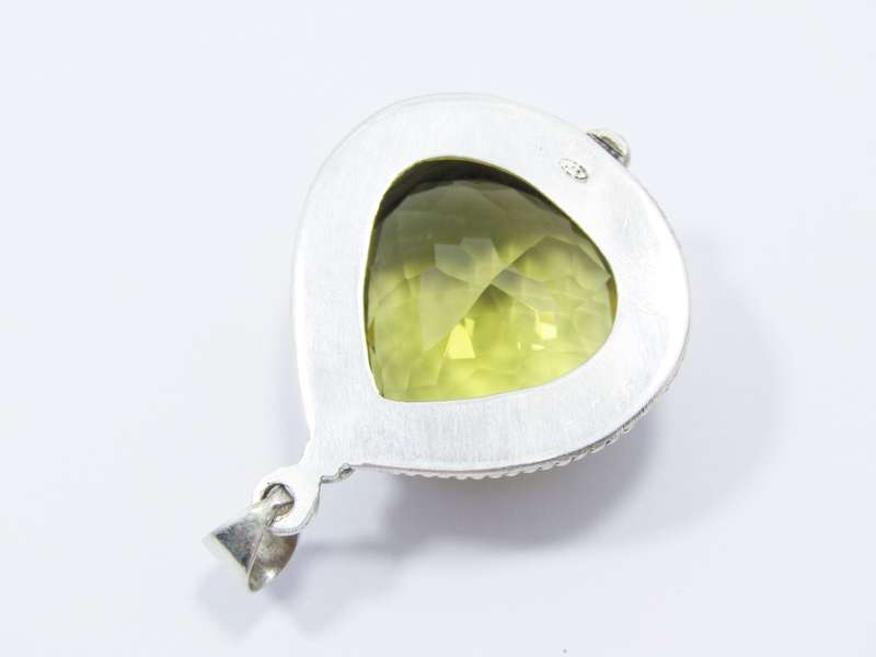 A Gorgeous Huge Faceted Lemon Quartz Pendant in Sterling Silver.