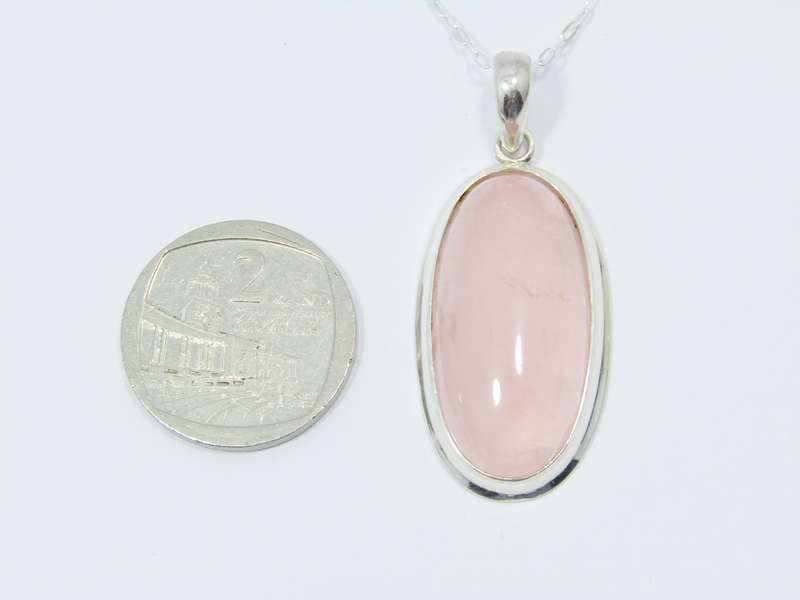 A Lovely Large Rose Quartz Pendant on Chain in Sterling Silver.