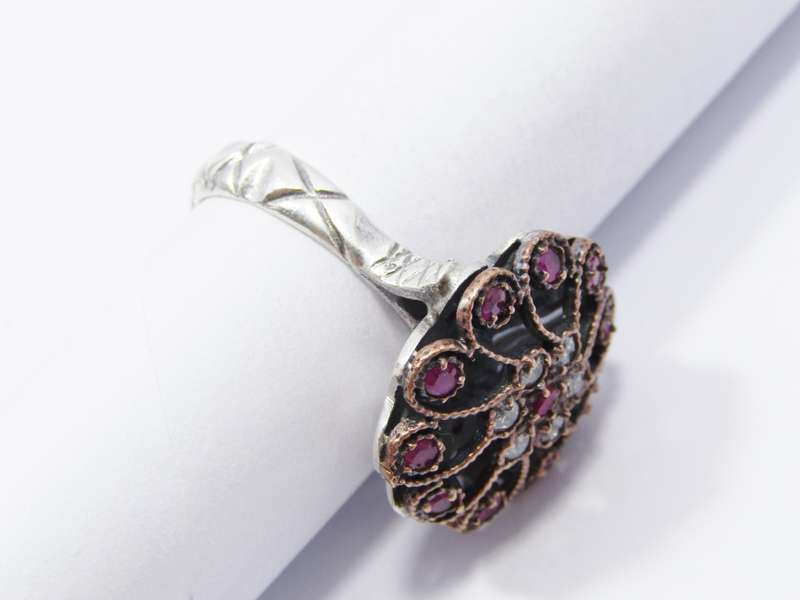 A Lovely Two Tone Eastern Design Ring With Pink and Clear Paste Stones in Sterling Silver.