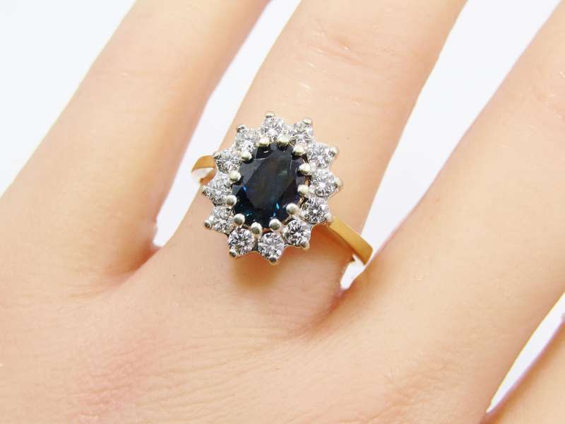 Captivating 18CT Gold, Sapphire & Diamond Halo Ring
