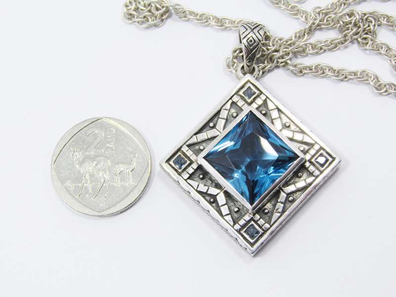 A Stunning Huge Vivid Blue Zirconia Pendant on Chain in Sterling Silver.