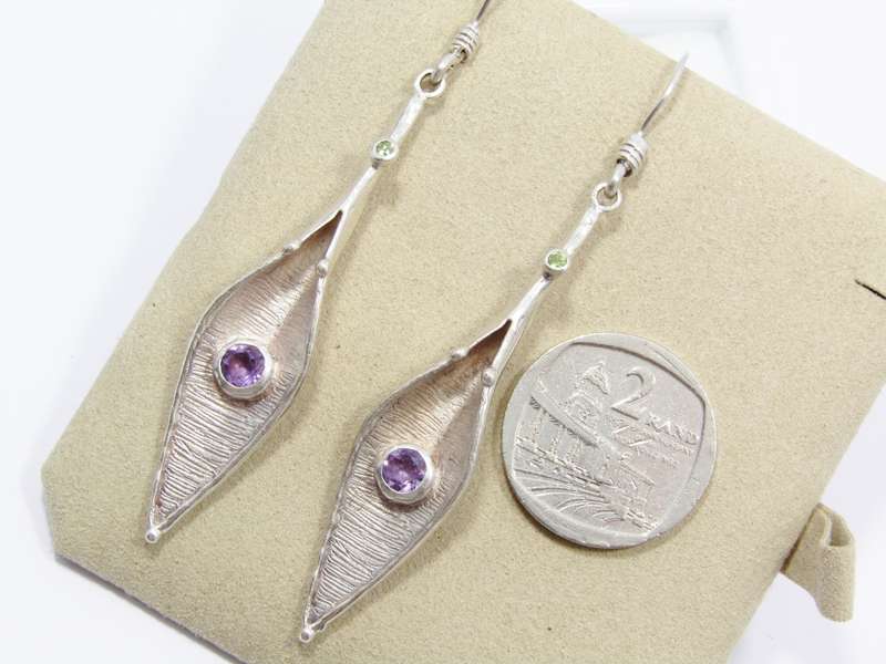 A Gorgeous Pair of Arum Lilly Design Dangling Earrings Set With Amethysts and Peridot Gemstones in S