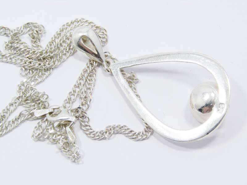 A Beautiful Large Teardrop Design Freshwater Pearl Pendant on Chain in Sterling Silver.