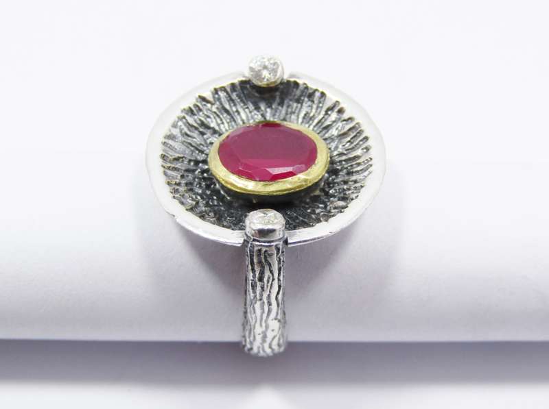 A Stunning Two Tone Brass over Sterling Silver ring with a Synthetic Ruby in Sterling Silver.
