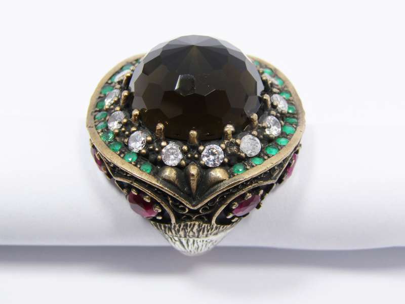 A Gorgeous Huge Facetted Smokey Color Crystal Surrounded With Pink Green and Clear Crystals in Sterl