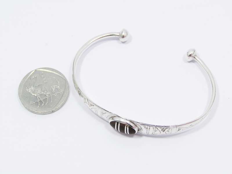 A Beautiful Tuareg Style Cuff Bangle With a Ebony Wood in The Center in Sterling Silver