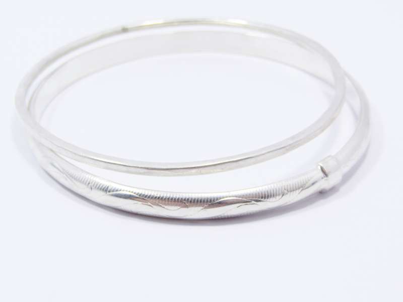 Two Lovely Stack Bangles in Sterling Silver.