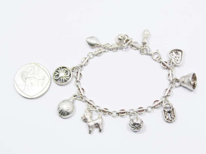 A Very Pretty Vintage Charm Bracelet in Sterling Silver