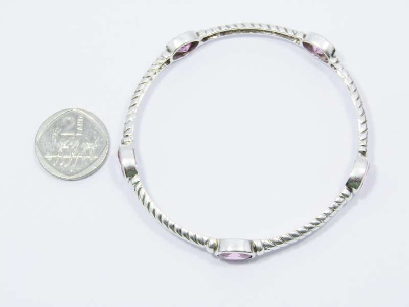A Gorgeous Weight Pink Stone Bangle in Sterling Silver.