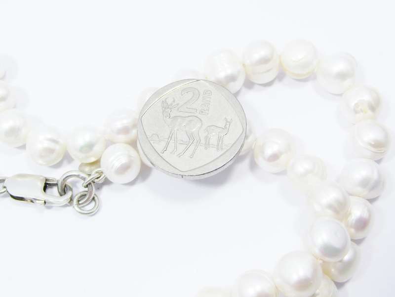 A Beautiful String of Fresh Water Pearl Necklace With a Sterling Silver Clasp. R2050 