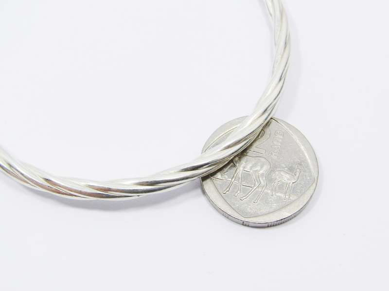 A Lovely Twisted Bangle in Sterling Silver.