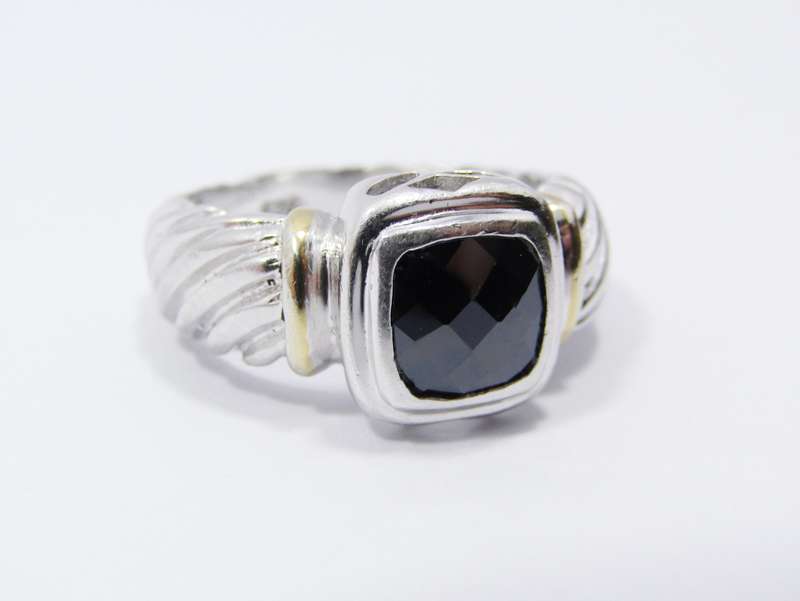A Lovely Facetted Two Tone Black Stone ring in Sterling Silver.