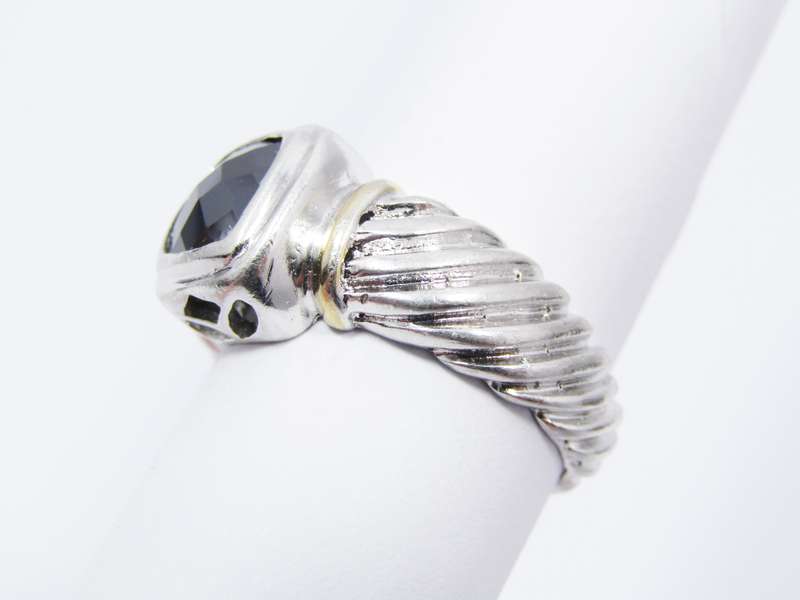 A Lovely Facetted Two Tone Black Stone ring in Sterling Silver.
