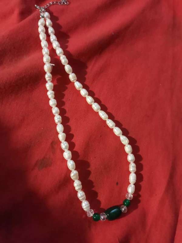 Beautiful string of pearls,stainless steel clasp with green beryl insert