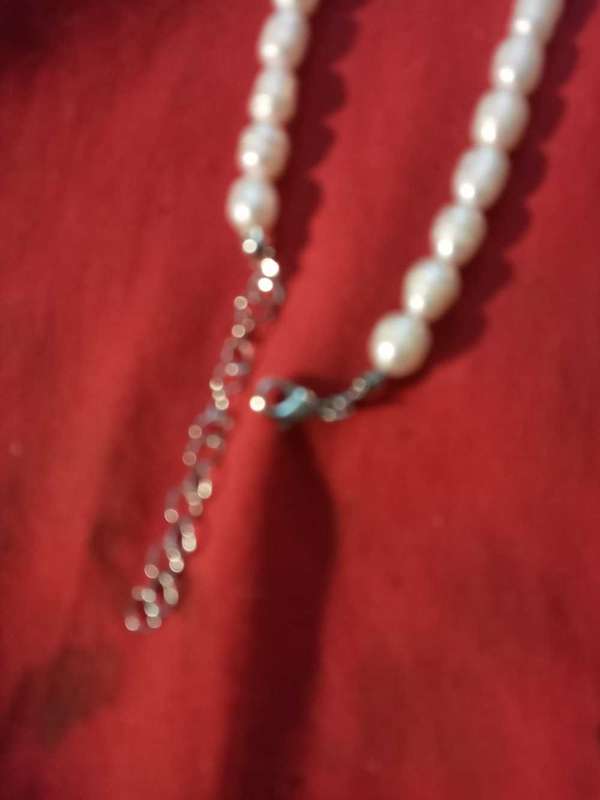 Beautiful string of pearls,stainless steel clasp with green beryl insert