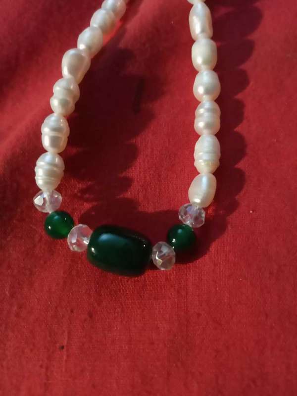 Beautiful string of pearls,stainless steel clasp with green beryl insert