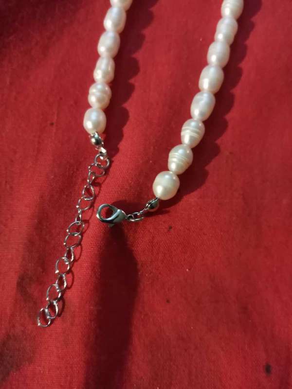Beautiful string of pearls,stainless steel clasp with green beryl insert