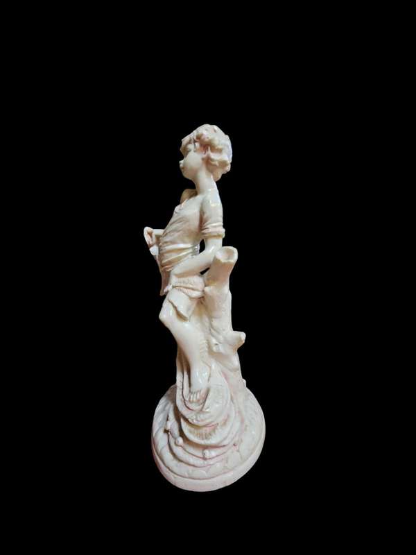 Le Ron stone-lite ornamental display figurine of a young boy
